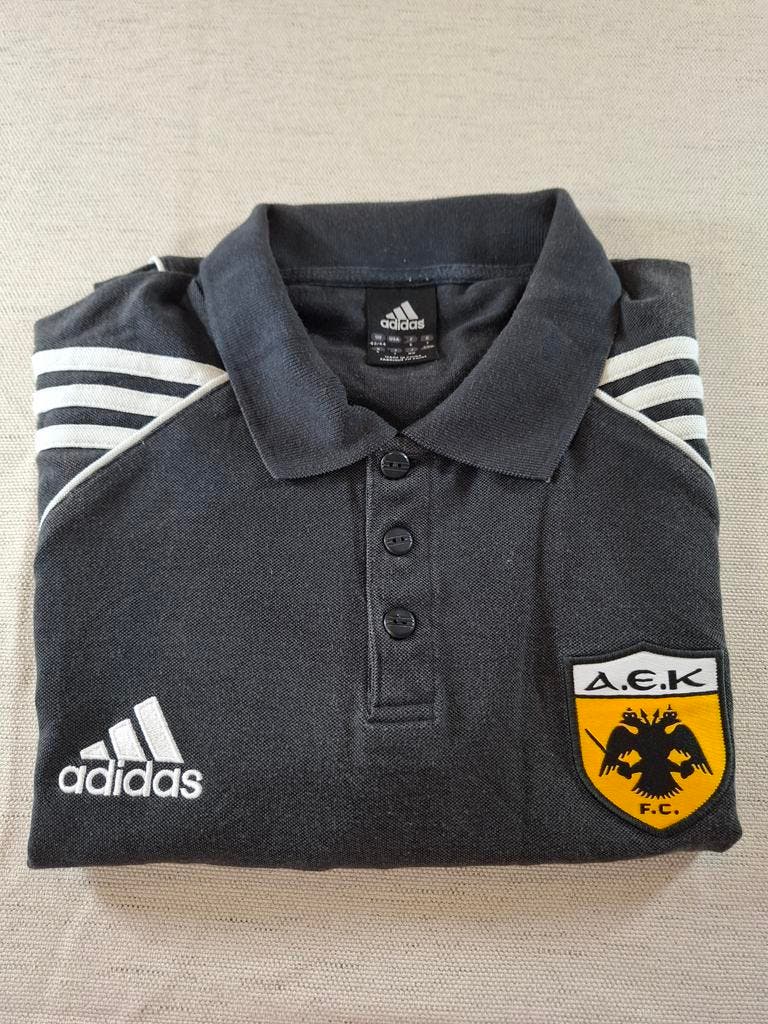 000127 – Adidas AEK Athens Polo – Black, Size L (UK 42/44)