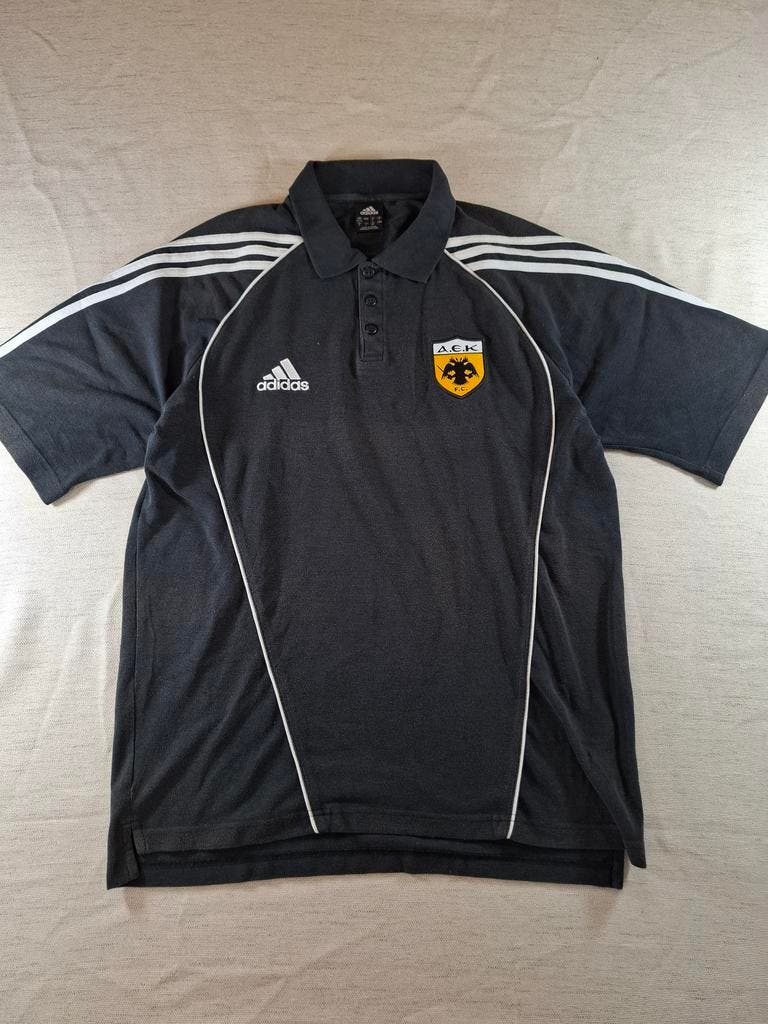 000127 – Adidas AEK Athens Polo – Black, Size L (UK 42/44)