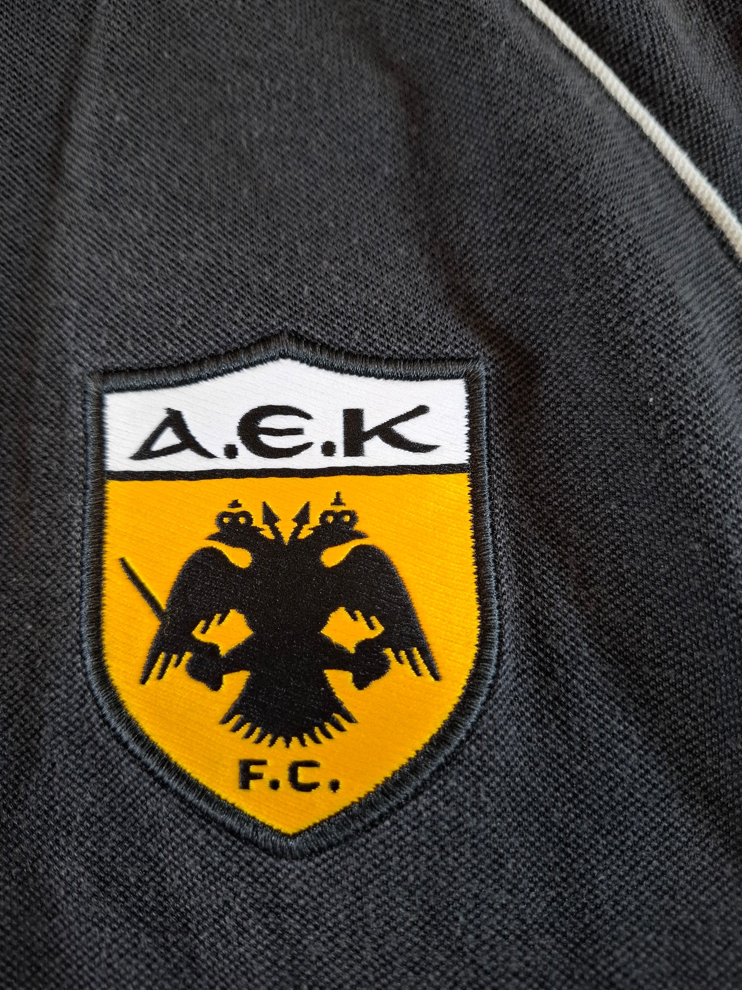 000127 Adidas AEK Athens polo size L (uk 42/44) Black
