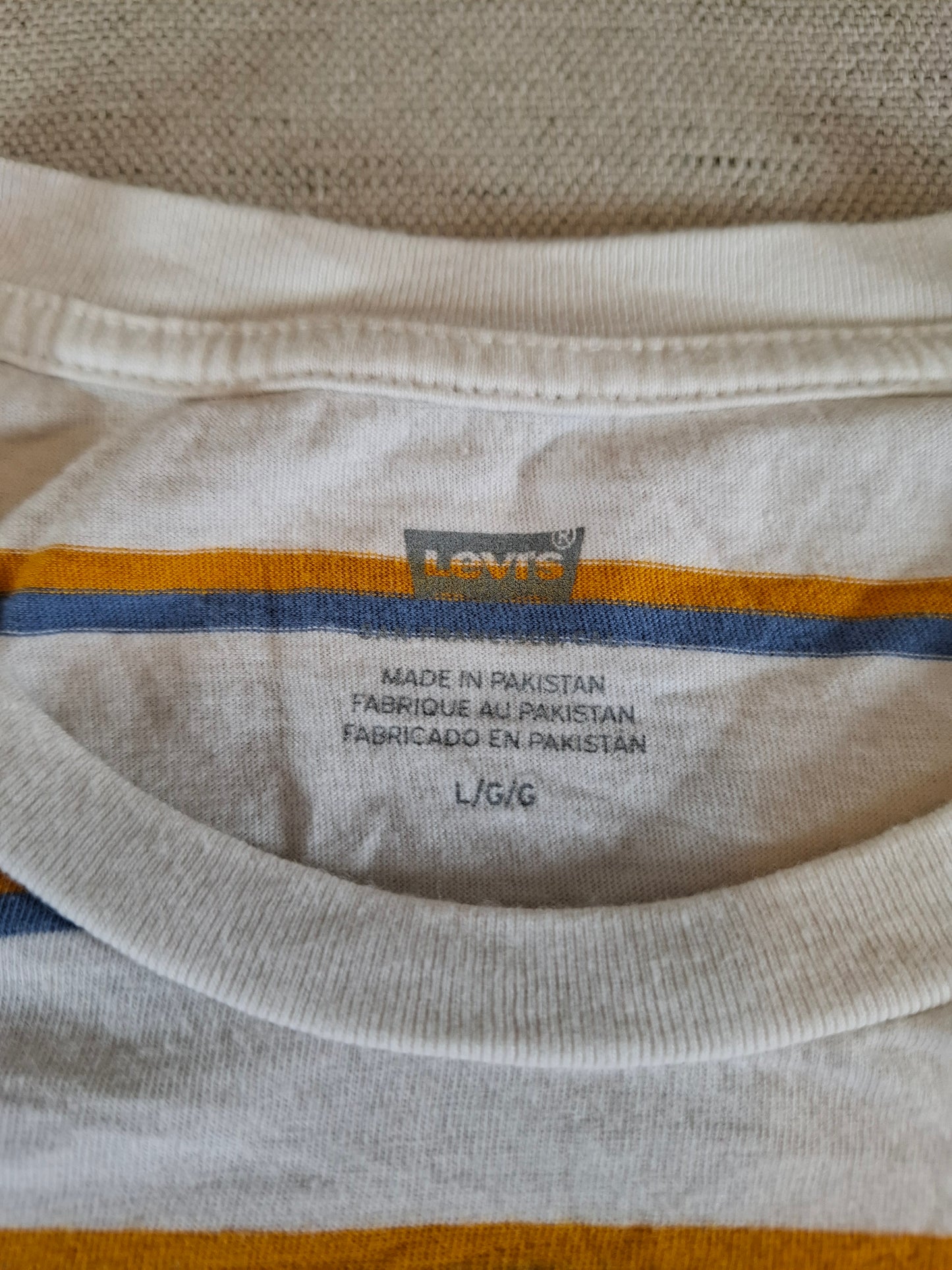 001137 Levi's T-shirt size L White/ Yellow/ Blue striped.